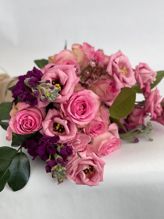 Happy Birthday wrapped bouquet by Luminous Blooms in Highland Park