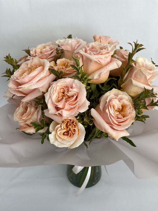 a dozen of roses by Luminous Blooms in Highland Park