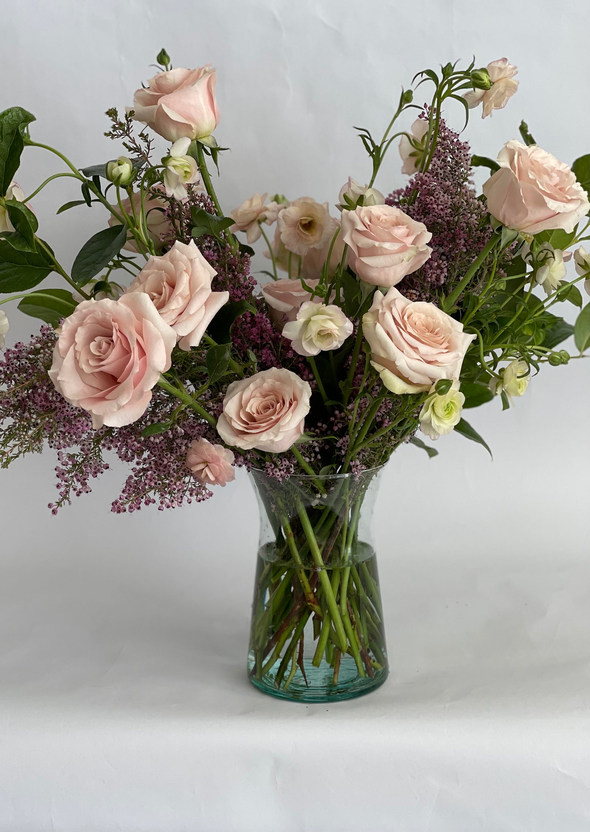 dozen of roses by Luminous Blooms in Highland Park