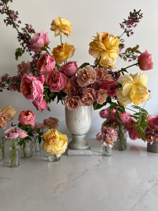 Lush dinner arrangements with garden roses by Luminous Blooms in Highland Park